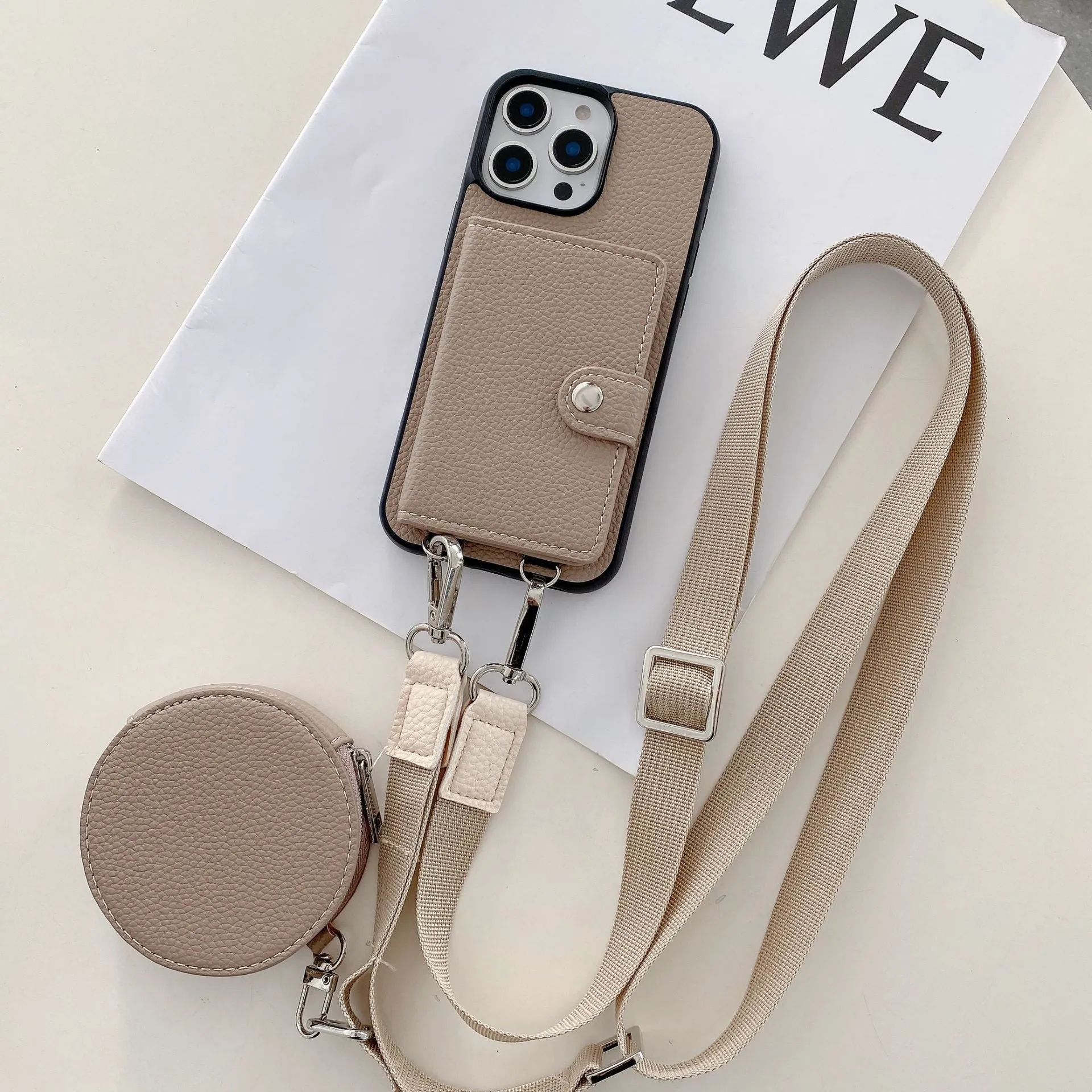 Black PC leather iPhone case with a visible card slot and a lanyard loop on the corner.