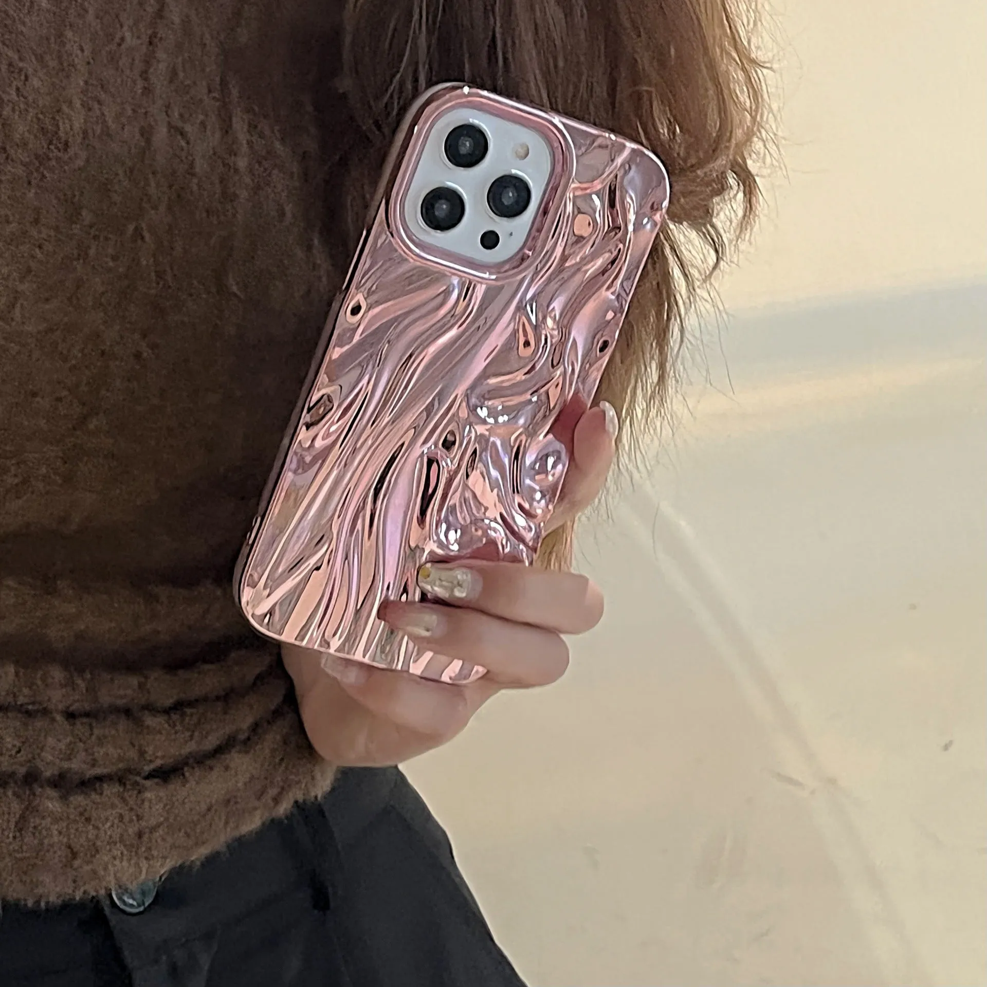 Soft TPU iPhone case with a textured pleated pattern in a rose red electroplated colour.