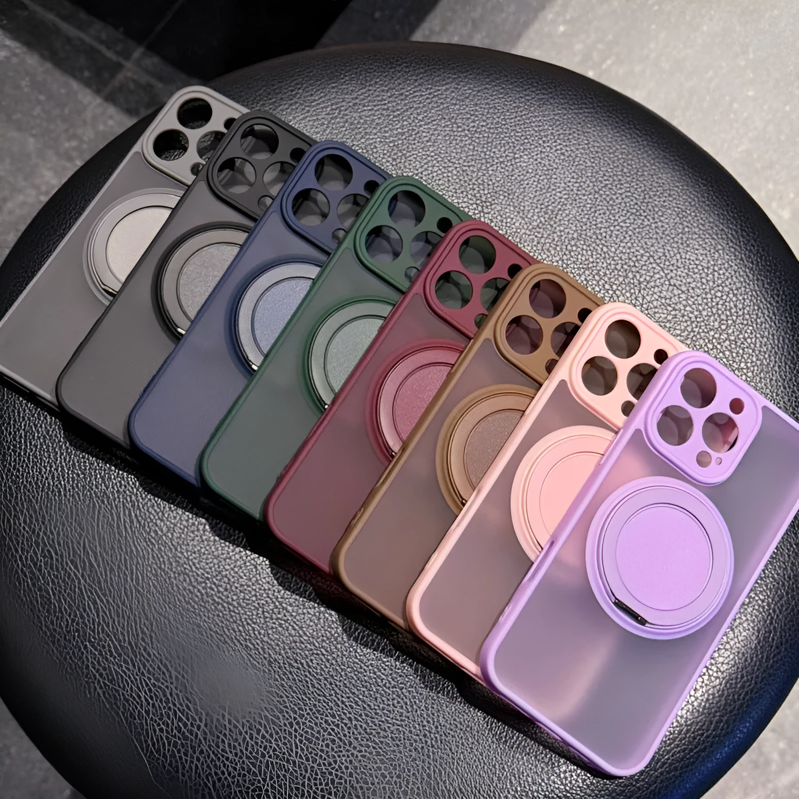 Frosted transparent magnetic iPhone case with a built-in kickstand, shown in plum colour.
