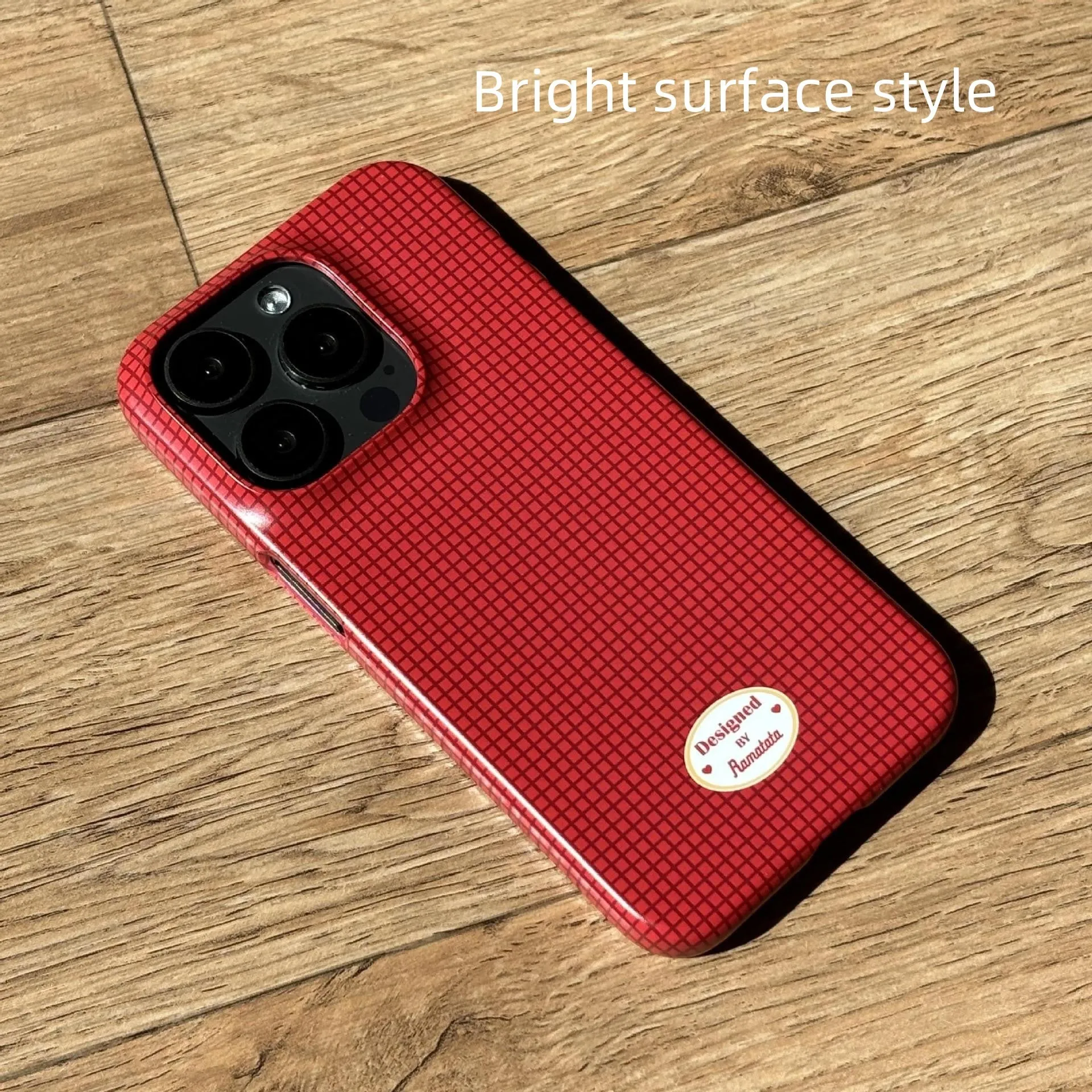 iPhone 15 Pro Max phone case with plaid design in red or orange grid pattern