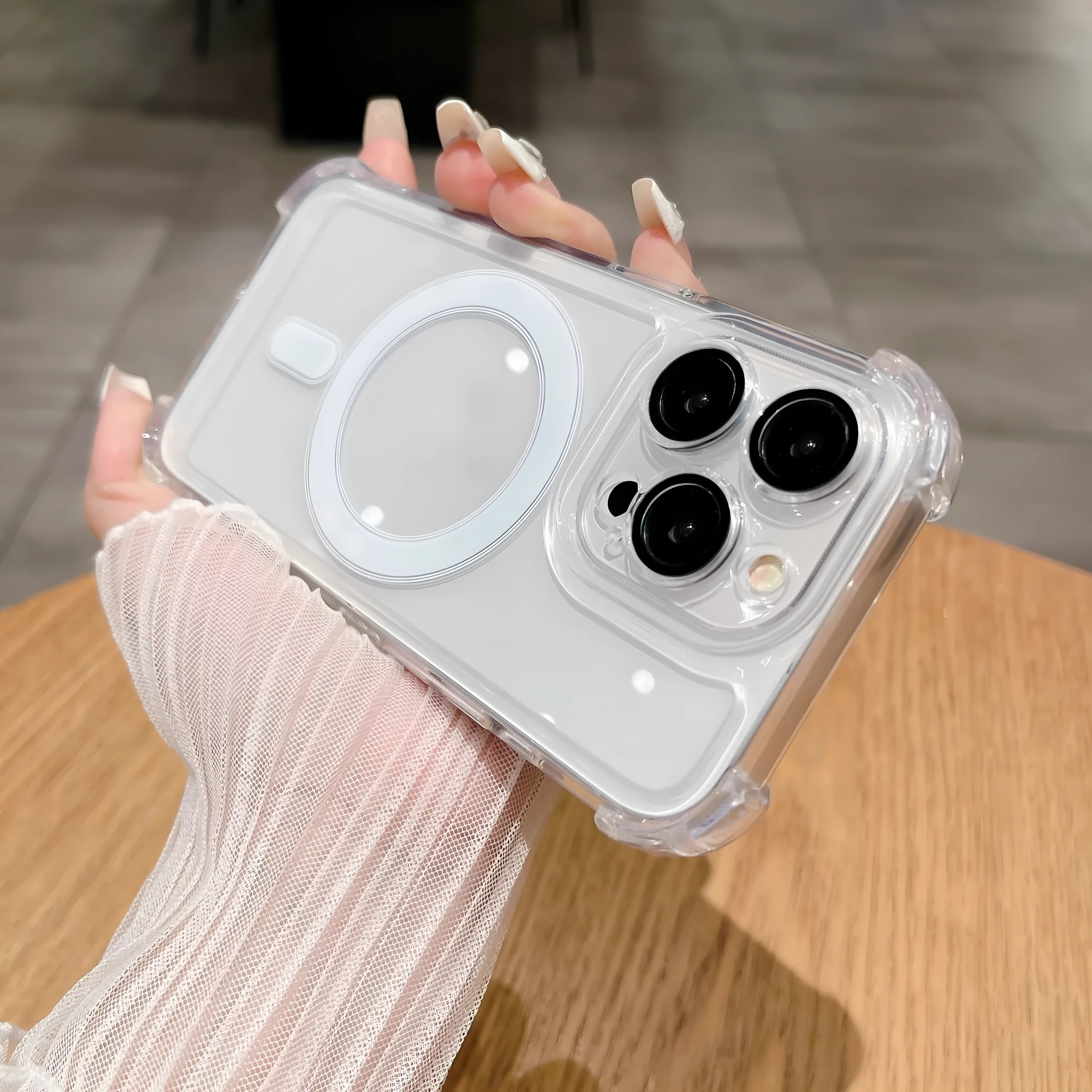 Transparent magnetic airbag silicone phone case with lens protector for iPhone models.