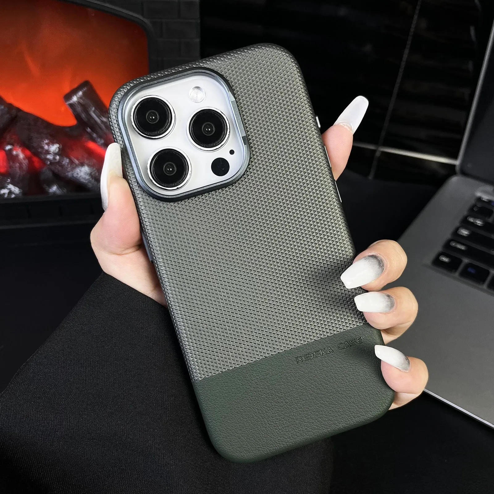 Magnetic iPhone case with dragon scale texture and leather stitching in black colour