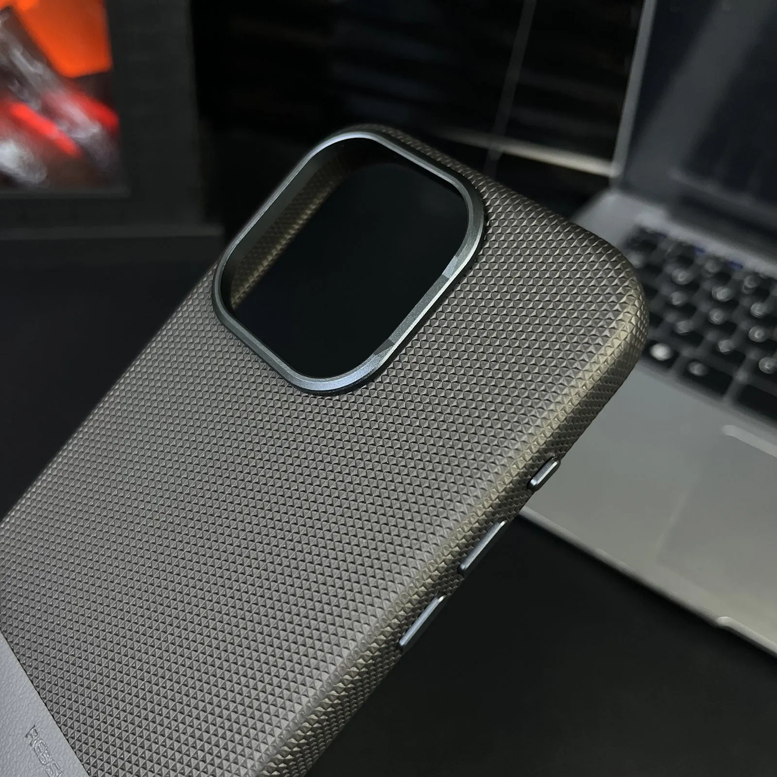 Magnetic iPhone case with dragon scale texture and leather stitching in black colour