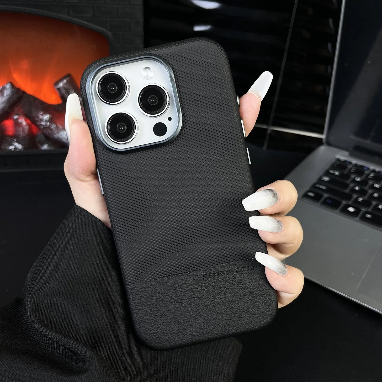 Magnetic iPhone case with dragon scale texture and leather stitching in black colour