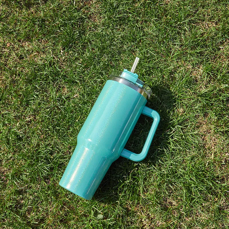 Large stainless steel vacuum insulation cup in a gradient colour finish, showing its size and simple design.