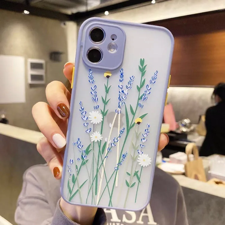 Matte pink lavender iPhone case with blue floral cartoon design and contrasting coloured frame.