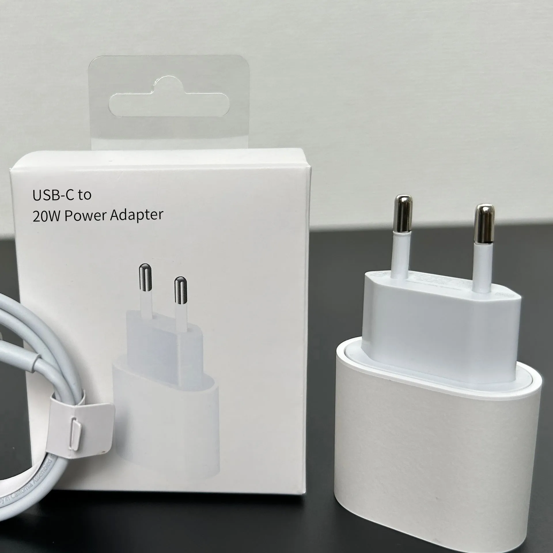 White 20W mobile PD charger with Type-C interface showing international plug compatibility