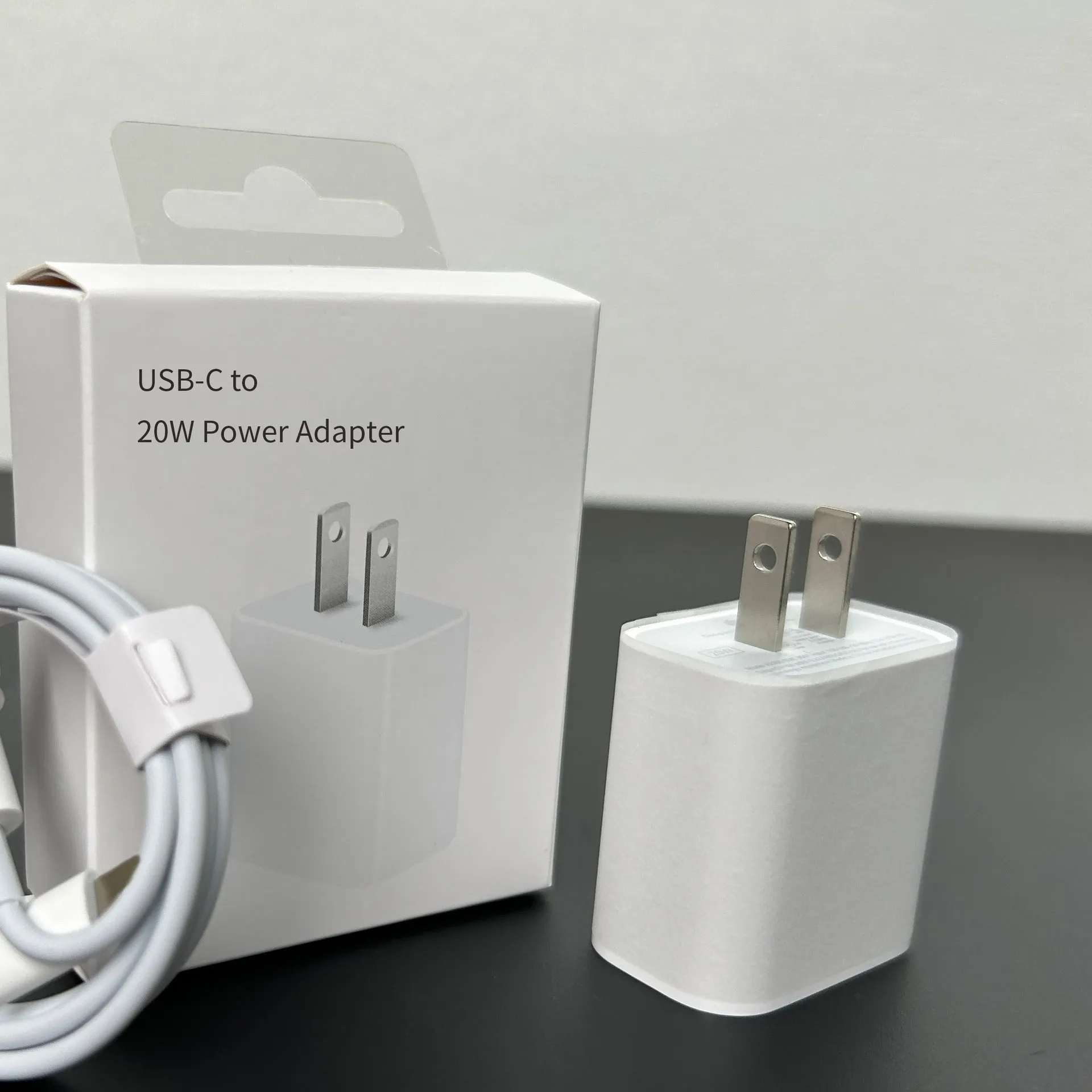 White 20W mobile PD charger with Type-C interface showing international plug compatibility