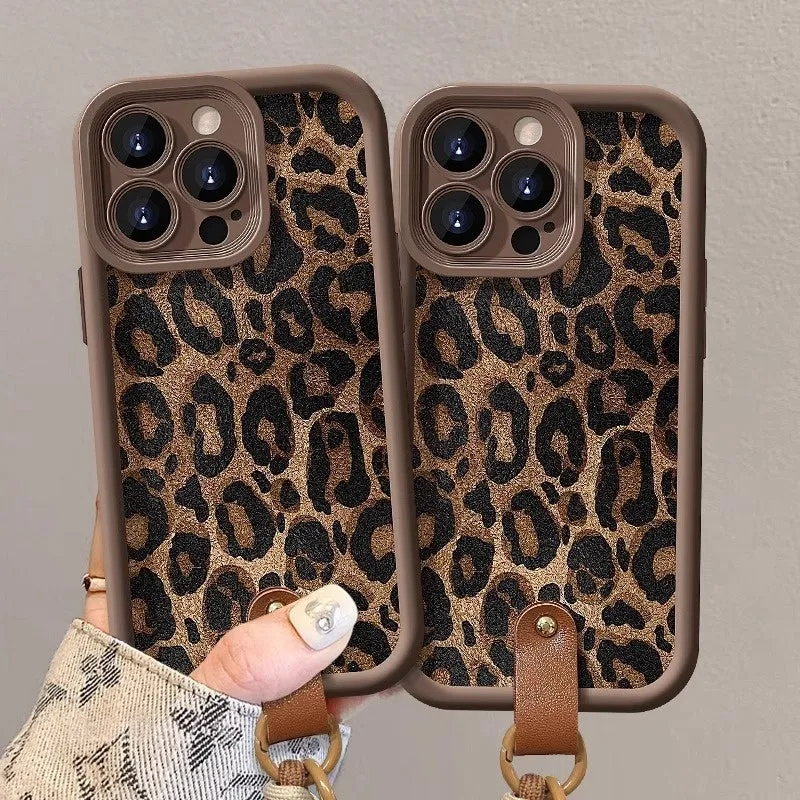 Brown leopard print silicone phone case with a detachable lanyard for an iPhone.