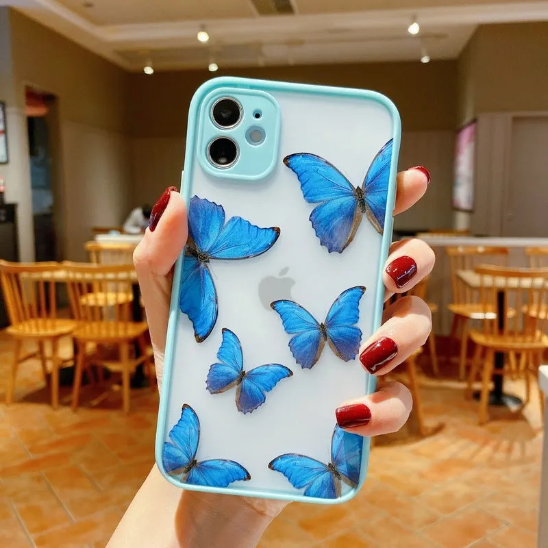 Butterfly design iPhone case with acrylic back and soft edge in pink, purple, and light blue colour options.