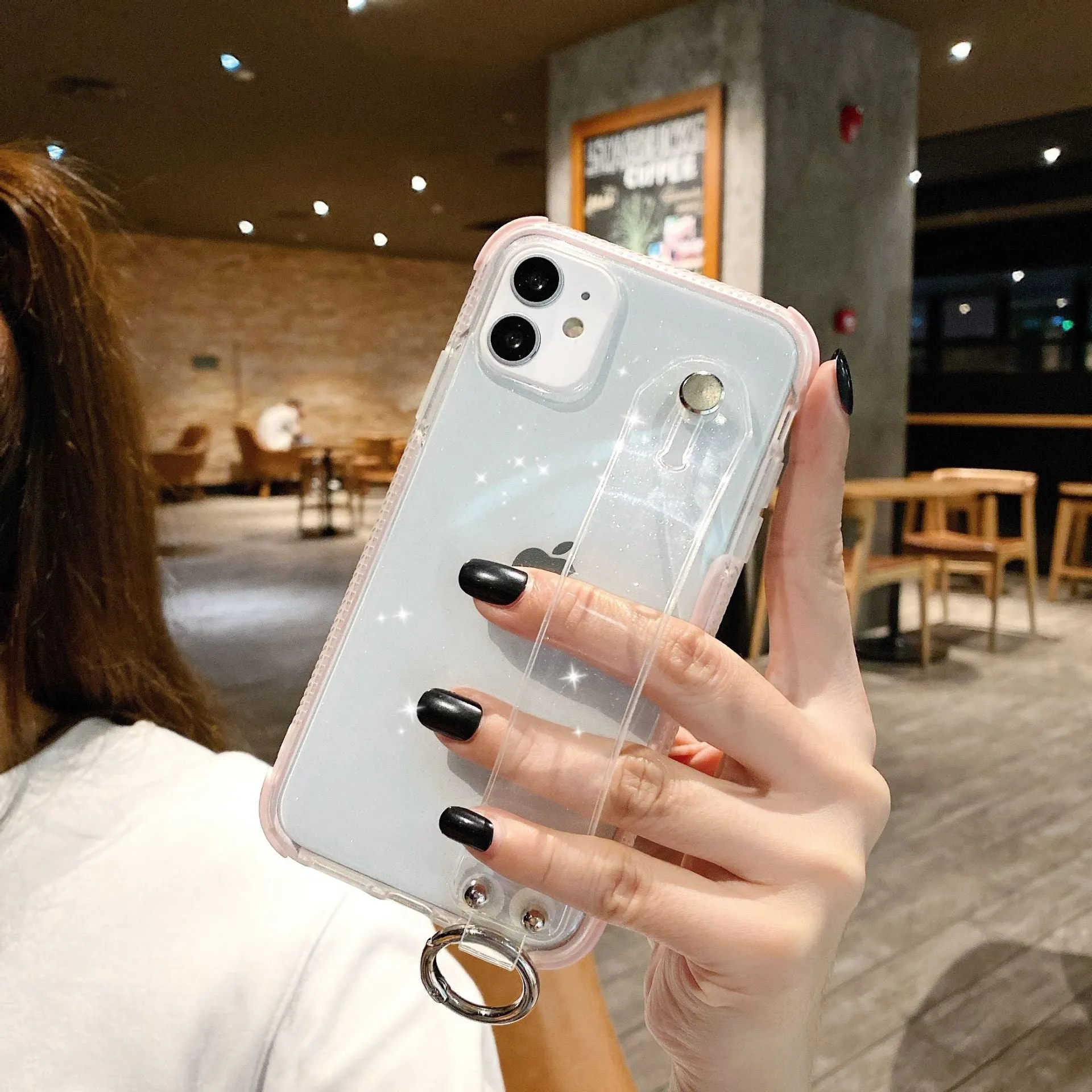 Clear glitter TPU back cover case for iPhone on a table, showing purple colour option.