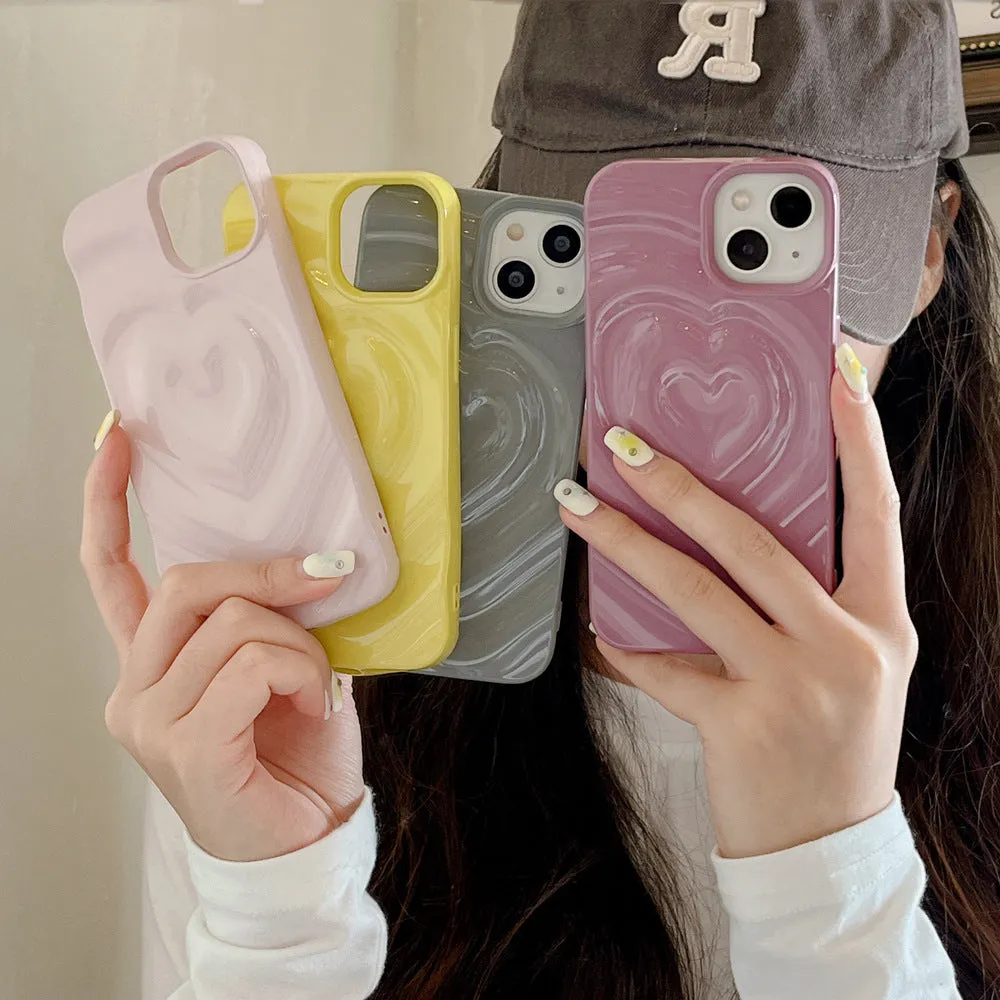 Solid colour TPU iPhone case with a raised 3D love design in bright purple.