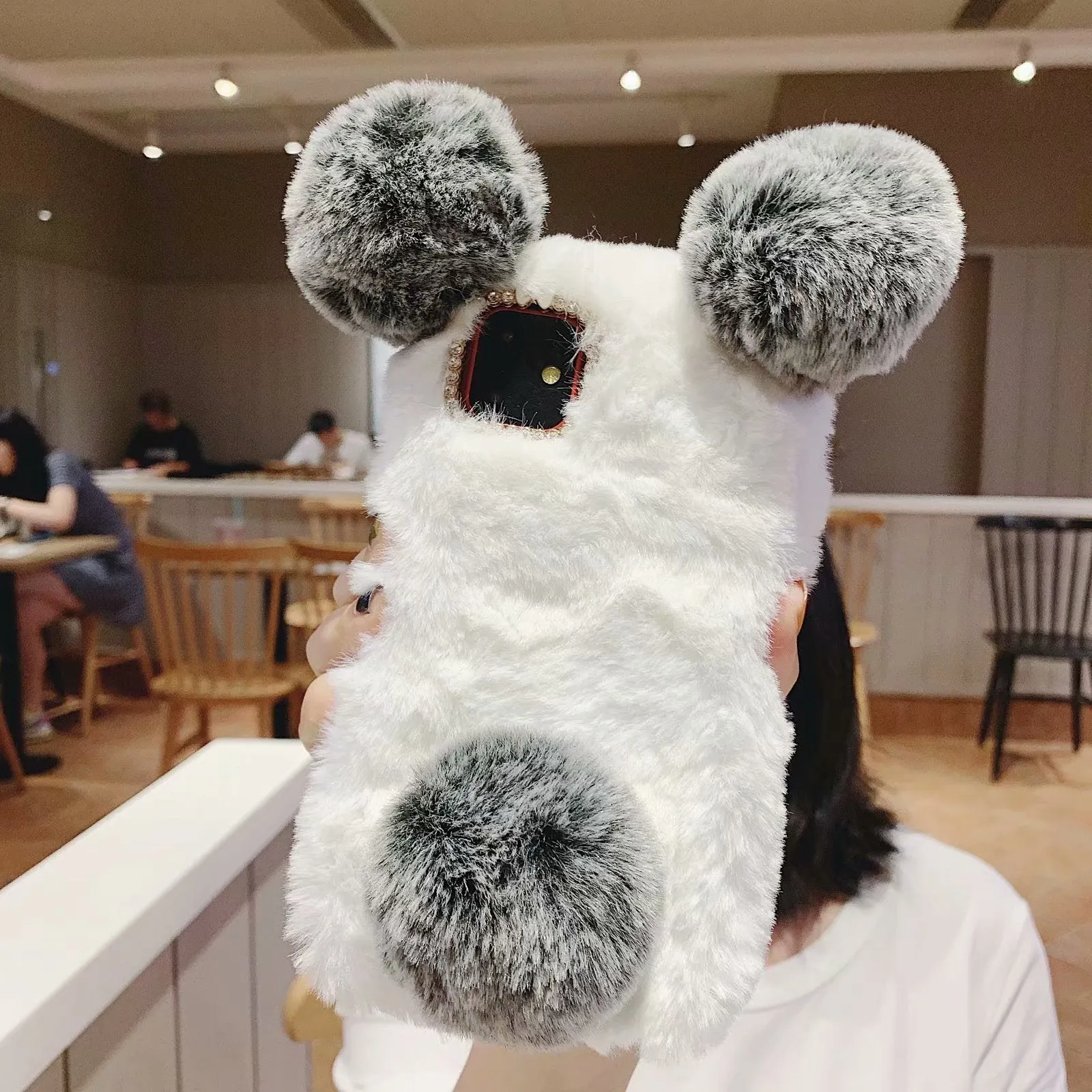 Soft grey bear plush TPU back cover case on an iPhone 11.