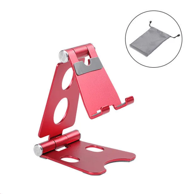 Foldable metal mini phone stand in gold black colour on a wooden desk