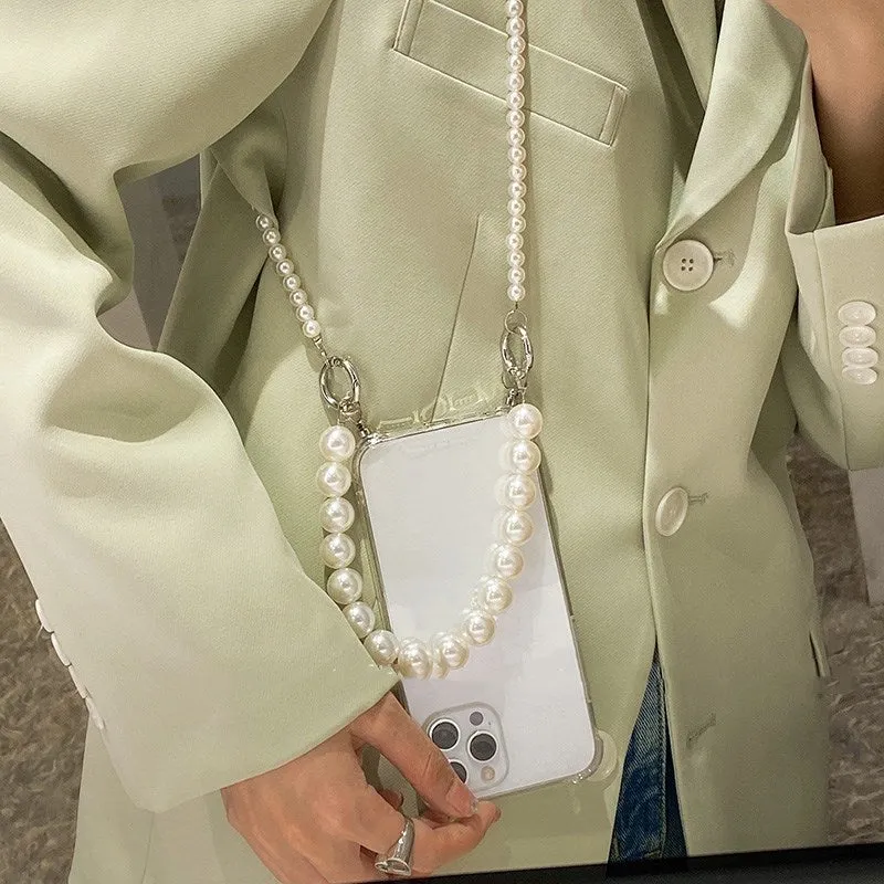 Soft Apple iPhone case with a large white pearl decoration and a silver chain attached.