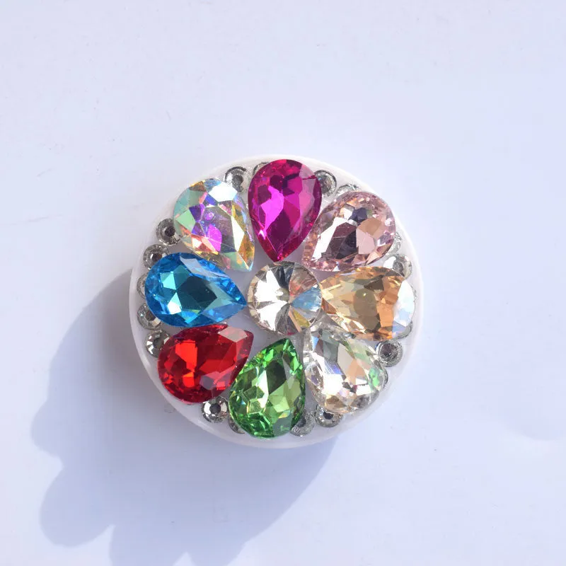 Rhinestone ring bracket phone holder for Apple and Android mobile phones on a desktop.
