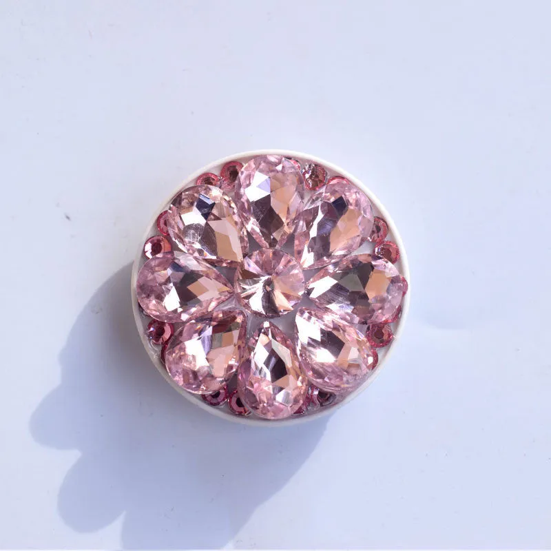 Rhinestone ring bracket phone holder for Apple and Android mobile phones on a desktop.