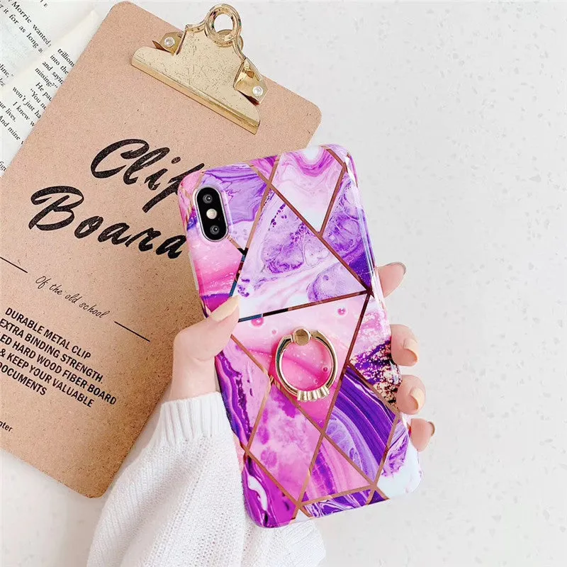 Geometric plating ring on a slim blue iPhone back cover case, showing the stand function.