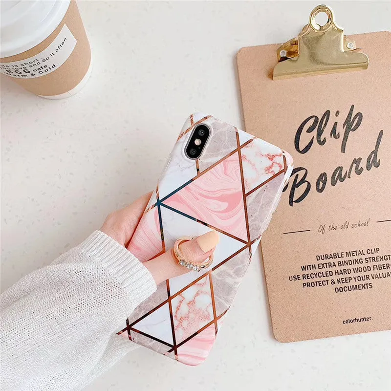 Geometric plating ring on a slim blue iPhone back cover case, showing the stand function.
