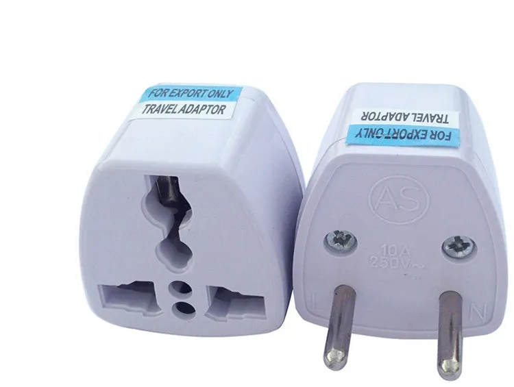 A multi country travel conversion plug for British, American, Australian, and European power sockets.