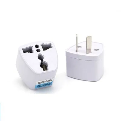 A multi country travel conversion plug for British, American, Australian, and European power sockets.