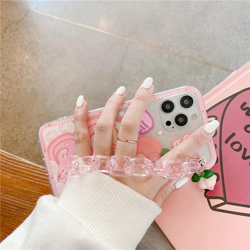 White silicone iPhone case with cartoon peach juice drink and bear design, shown with attached wrist strap.