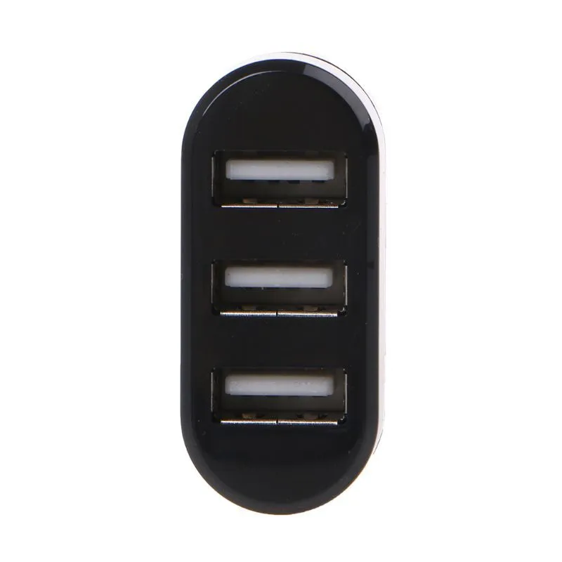 Black or white USB 2.0 four-port hub for laptop expansion on a desk.