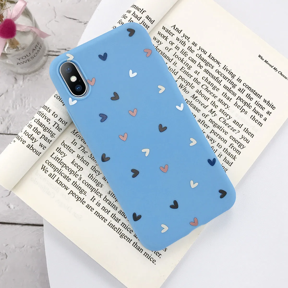 Transparent iPhone case with small flower and wave dot pattern in multiple colour options