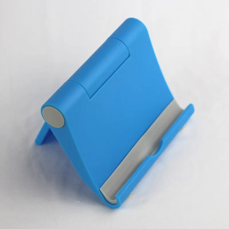 Anti-slip foldable phone holder with silicone pad in black, unfolded on a desk