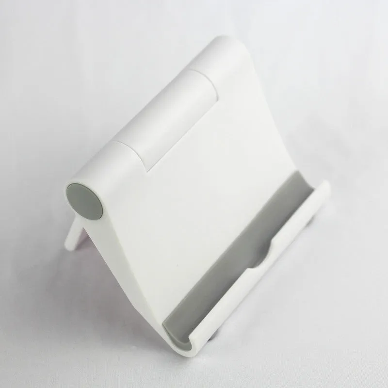Anti-slip foldable phone holder with silicone pad in black, unfolded on a desk