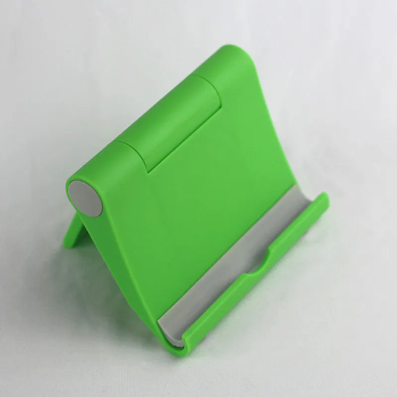 Anti-slip foldable phone holder with silicone pad in black, unfolded on a desk