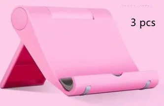 Anti-slip foldable phone holder with silicone pad in black, unfolded on a desk