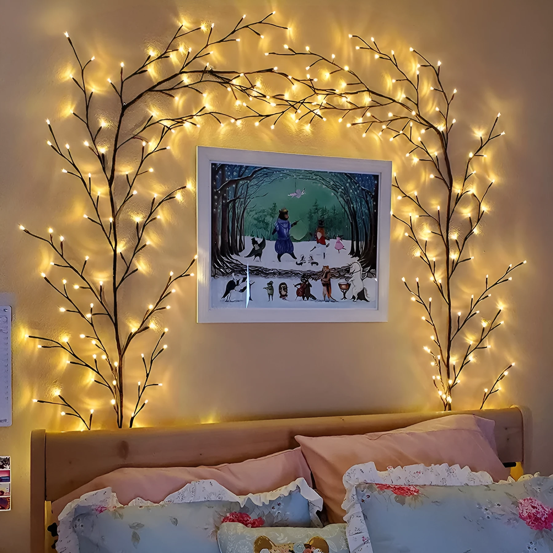 Flexible plastic LED vine garland with warm white lights shaped on a wall.