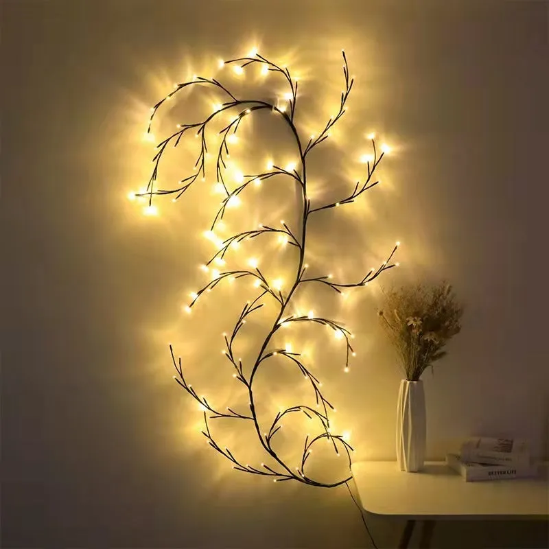 Flexible plastic LED vine garland with warm white lights shaped on a wall.
