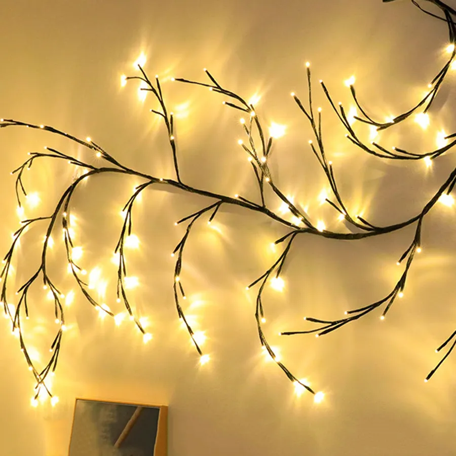 Flexible plastic LED vine garland with warm white lights shaped on a wall.