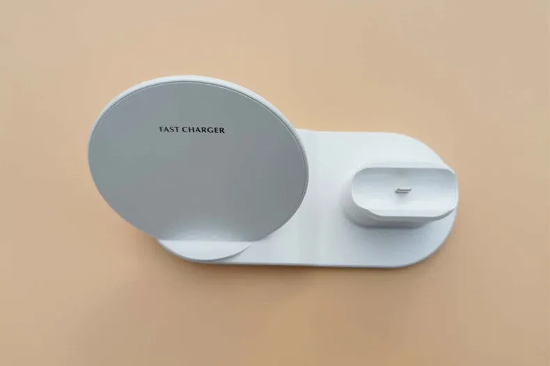 Black three-in-one wireless charger station with phone pad and watch output on a desk, 10W fast charging