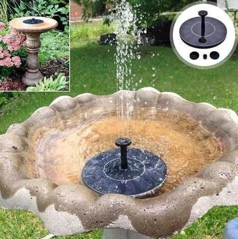 Black solar panel fountain pump with four nozzle heads for garden birdbaths and ponds.