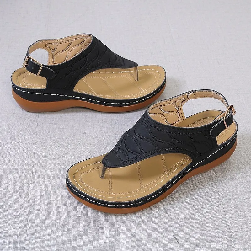 Women's red casual wedge heel sandals with an adjustable buckle strap on a white background.