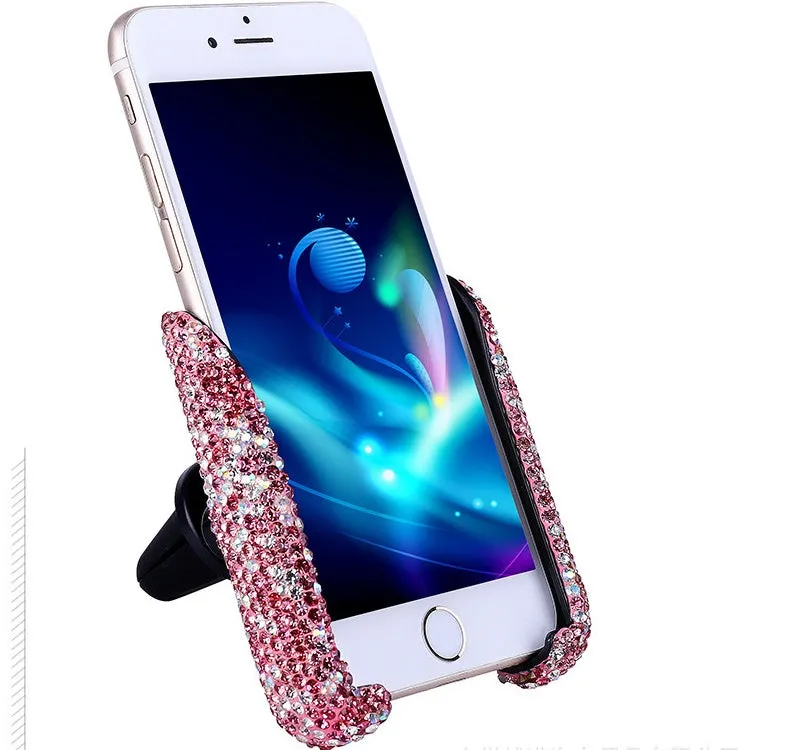 Car buckle mobile phone holder in ABS plastic on a car dashboard with a smartphone in place