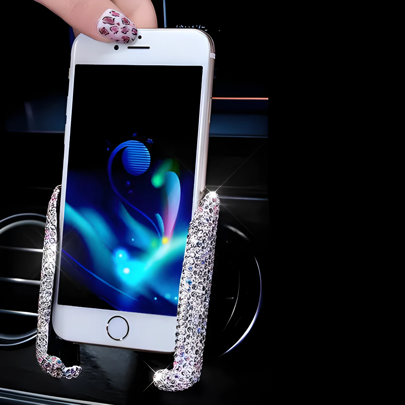 Car buckle mobile phone holder in ABS plastic on a car dashboard with a smartphone in place