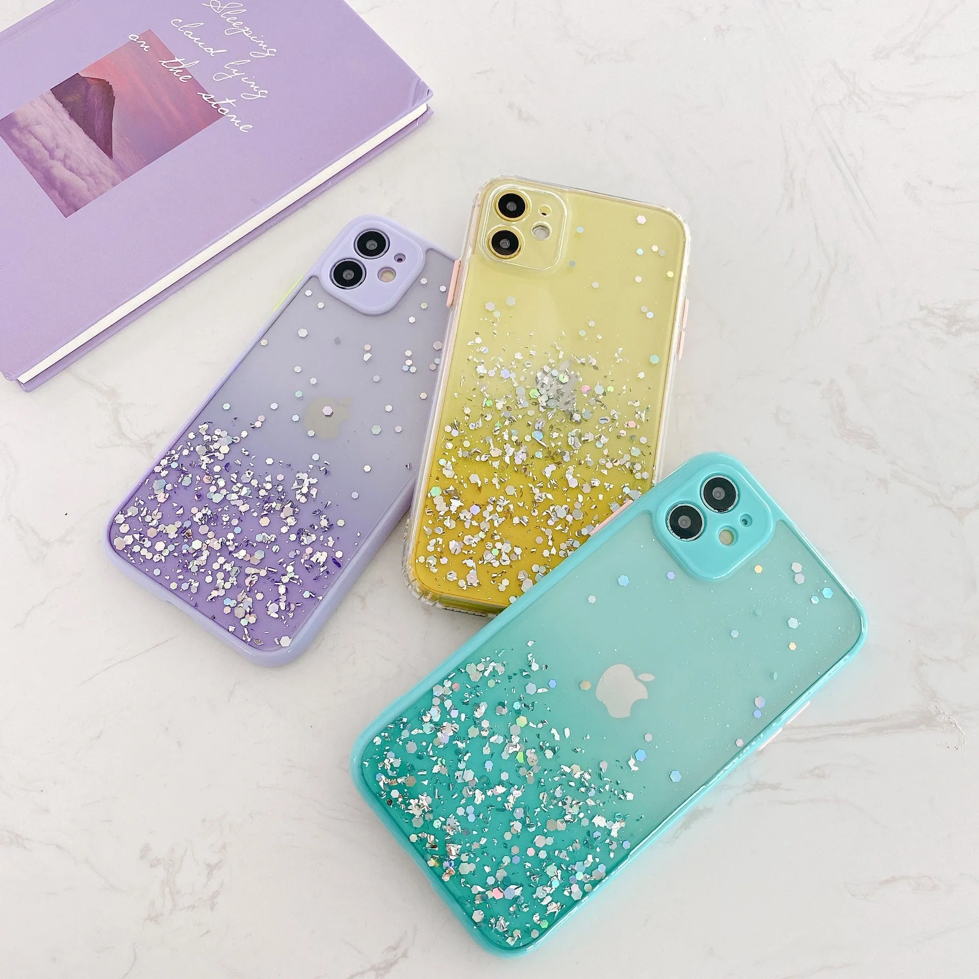 Silicone back cover for iPhone with frosted marble IMD finish and epoxy glitter gradient in multiple colours