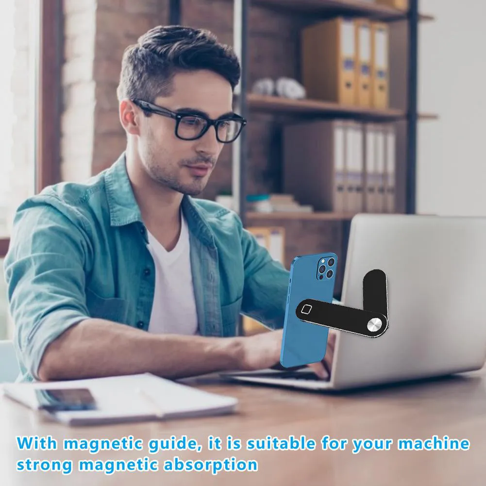Black aluminium laptop phone holder with magnetic clip attached to laptop edge holding a smartphone