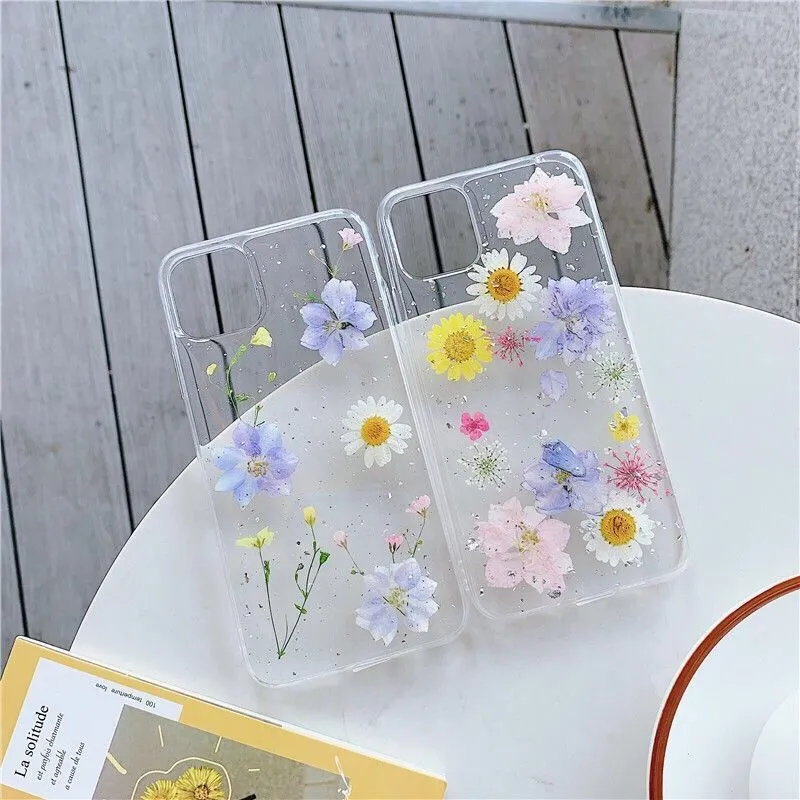 Transparent TPU phone case with real dried daisy flowers and gold glitter under clear epoxy coating
