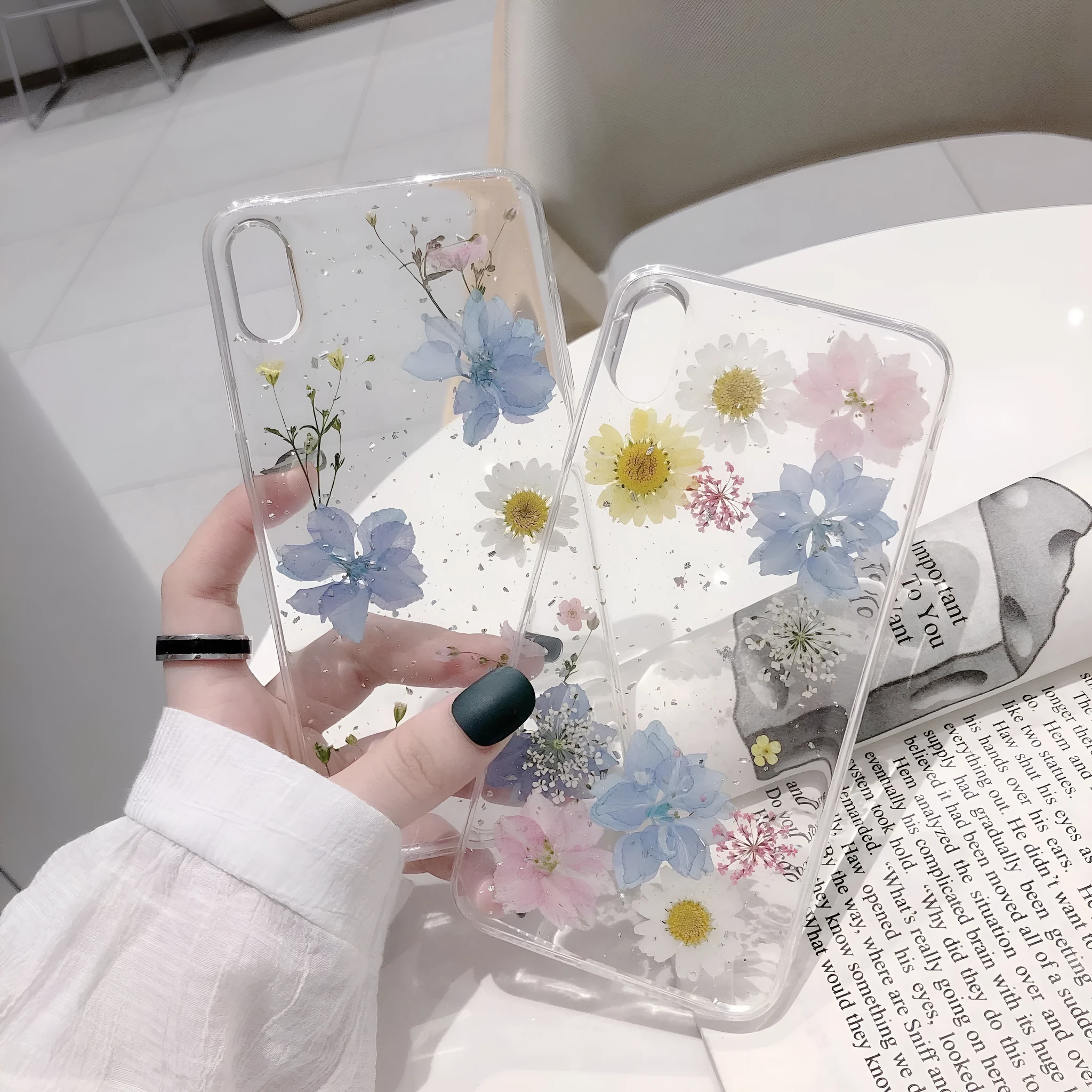 Transparent TPU phone case with real dried daisy flowers and gold glitter under clear epoxy coating