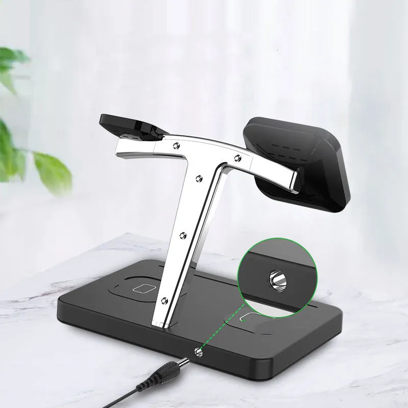Four-in-one magnetic wireless charger in black with Type-C interface, showing indication function light on charging surface.