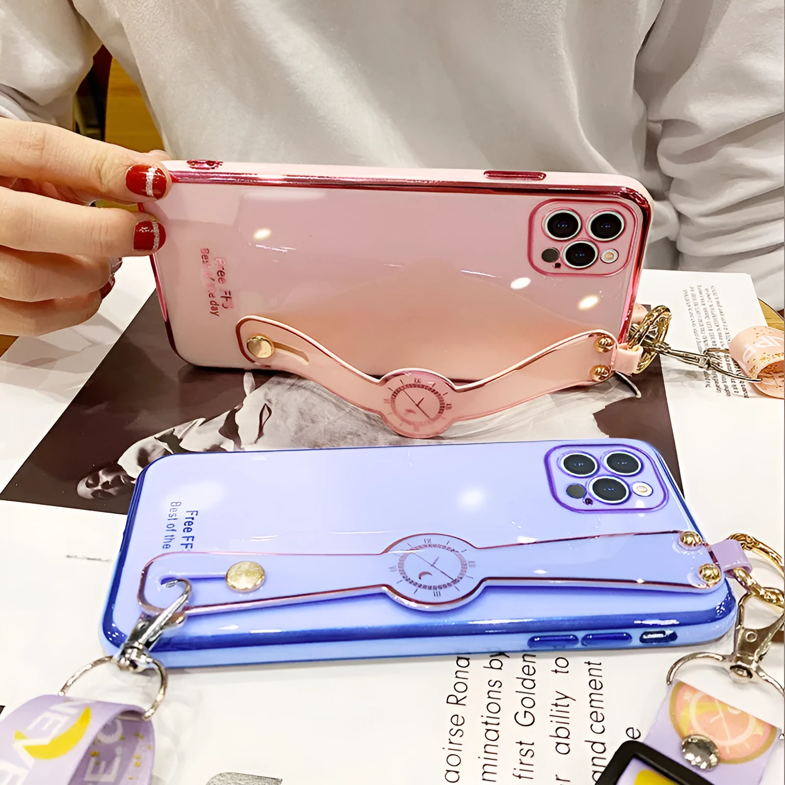 Electroplated TPU mobile phone case with wristband in pink for iPhone, all-inclusive back cover with precise cutouts