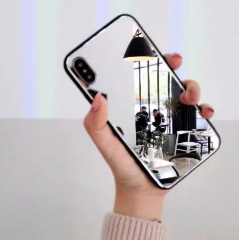 Black phone case for iPhone with a reflective mirror surface on the back.