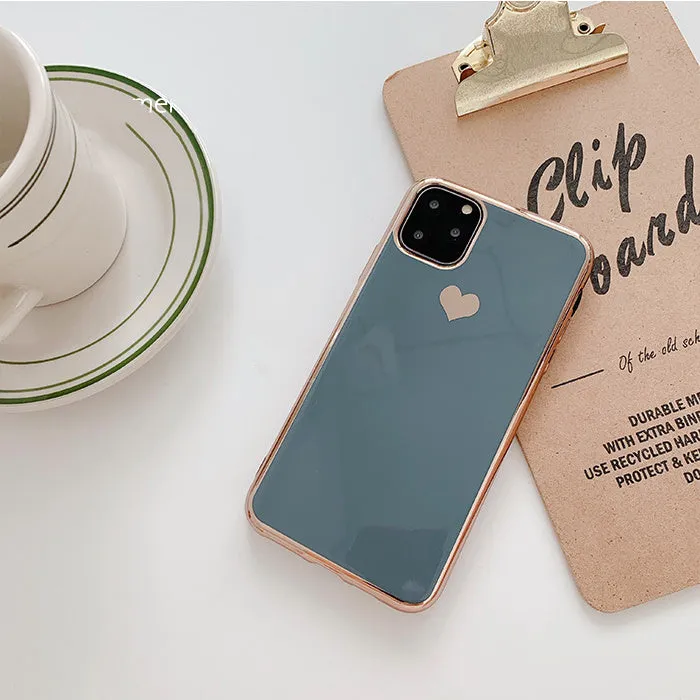 Luxury plating love solid colour TPU back cover case for iPhone on a table.