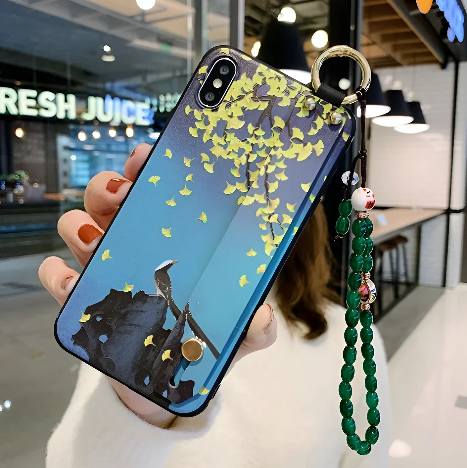Compatible iPhone case with a detachable rose flower wrist strap, shown in one of ten available styles.