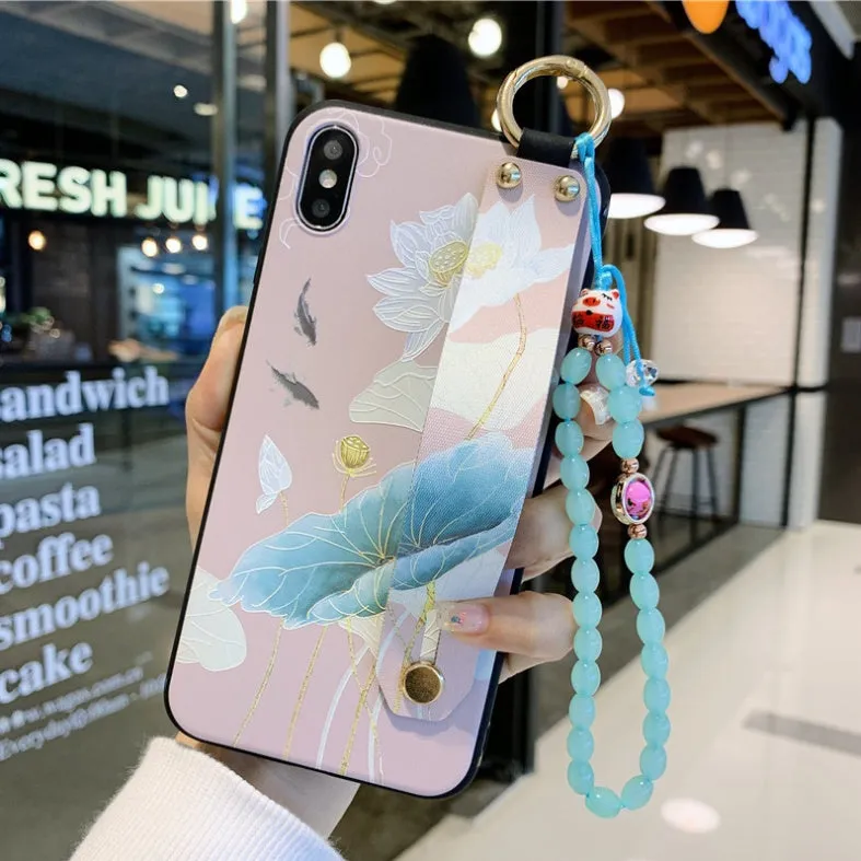 Compatible iPhone case with a detachable rose flower wrist strap, shown in one of ten available styles.